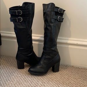 Black tall boots with a block heel